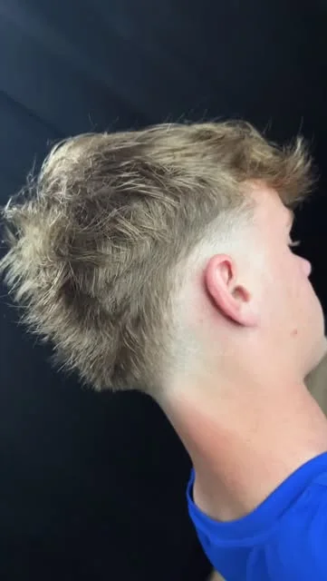 Finished textured haircut with a fade by Caleb