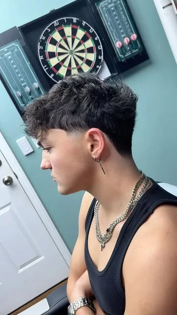 Client in Caleb’s chair for a mullet transformation